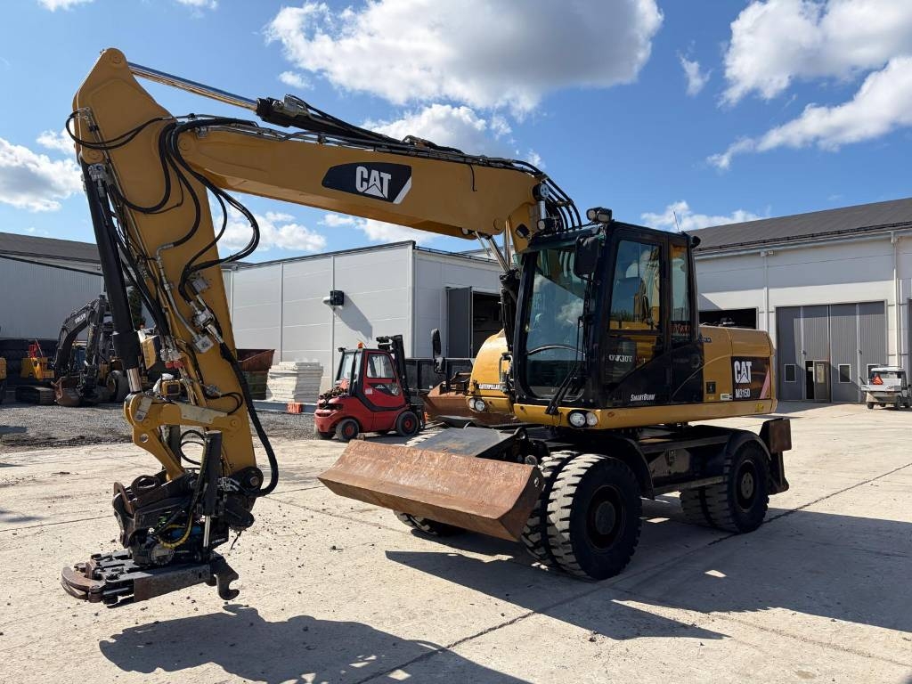 Pelle sur pneus Caterpillar M 315 D — occasion 2011, 11 607 h