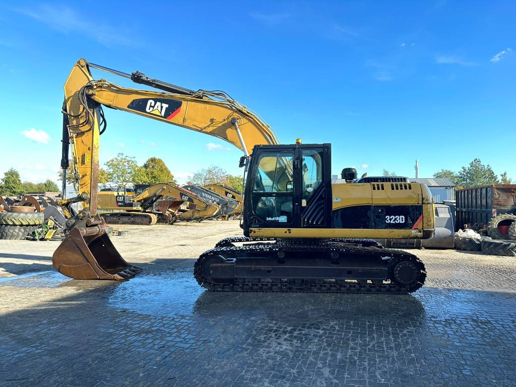 Pelle sur chenilles Caterpillar 323DL — occasion 2011, 9 244 h