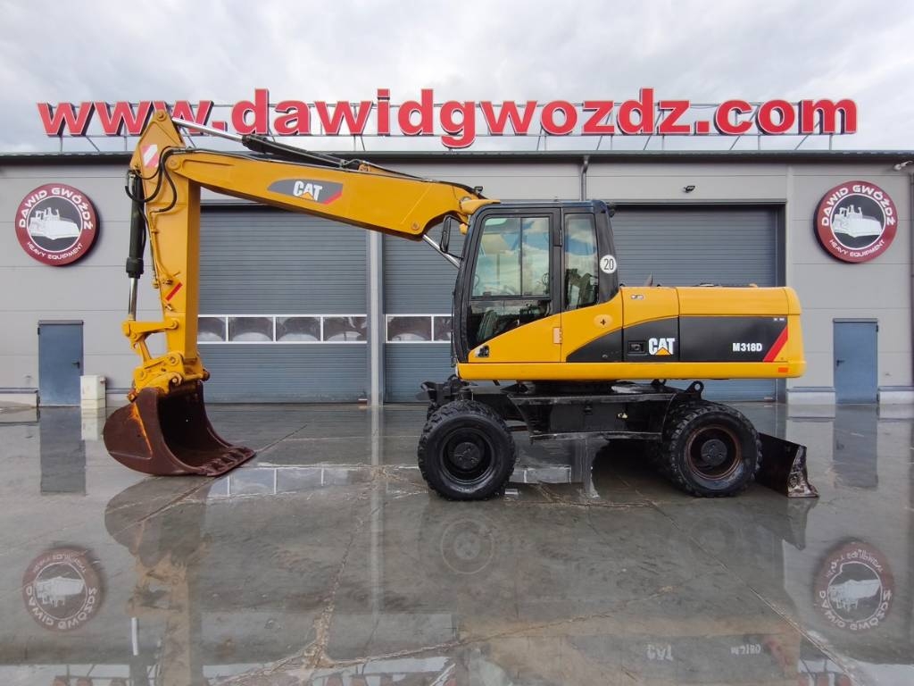Pelle sur pneus Caterpillar M 318 D — occasion 2007