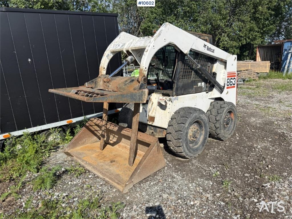 Bobcat 863 with forks and bucket