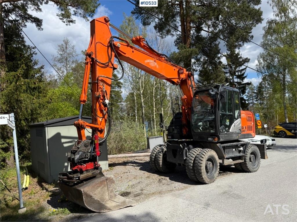 Hitachi ZX140W-5B wheeled excavator with rotor, trailer, a