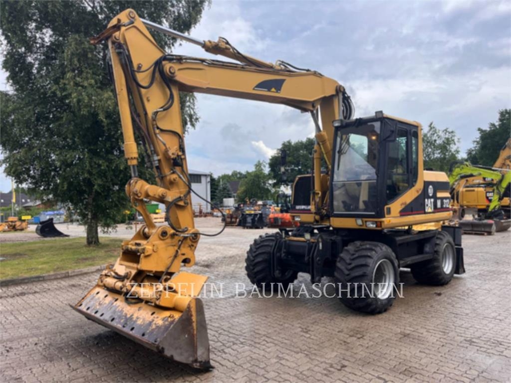 Pelle sur pneus Caterpillar M312 — occasion 2000, 11 244 h