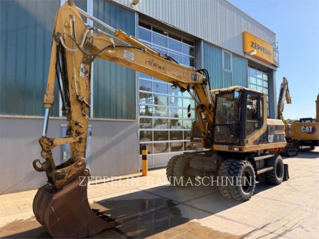 Pelle sur pneus Caterpillar M315 — occasion 1996, 9 788 h