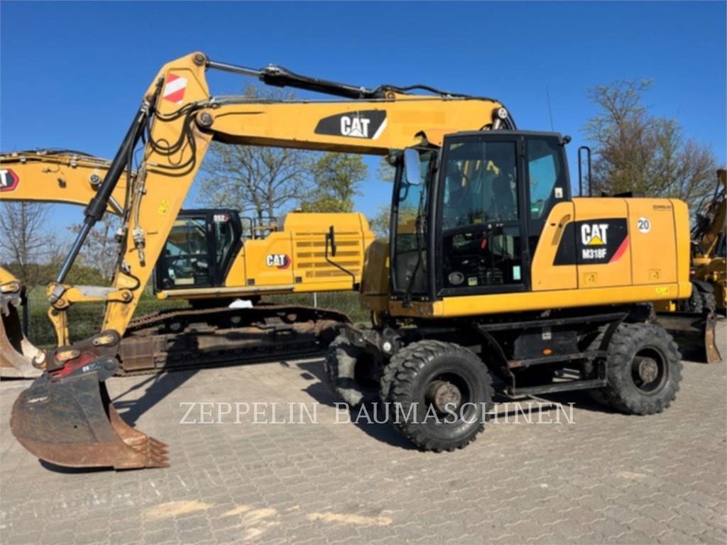 Pelle sur pneus Caterpillar M318F — occasion 2015, 7 050 h