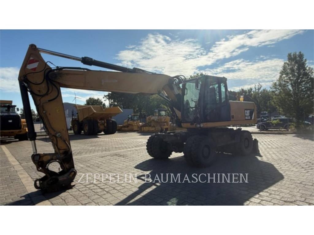 Pelle sur pneus Caterpillar M322D — occasion 2014, 13 808 h