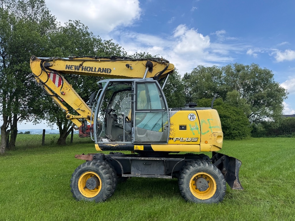Pelle sur pneus New Holland MH Plus — occasion 2009, 9 700 h