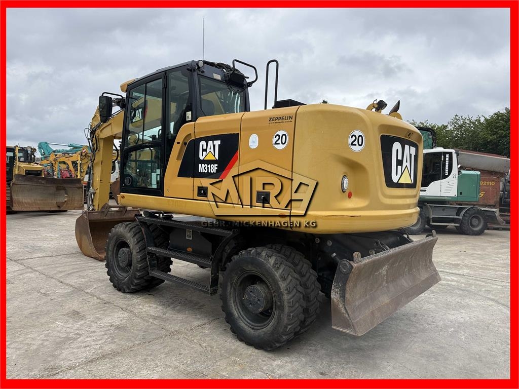 Pelle sur pneus Caterpillar M 318 F — occasion 2017, 10 708 h