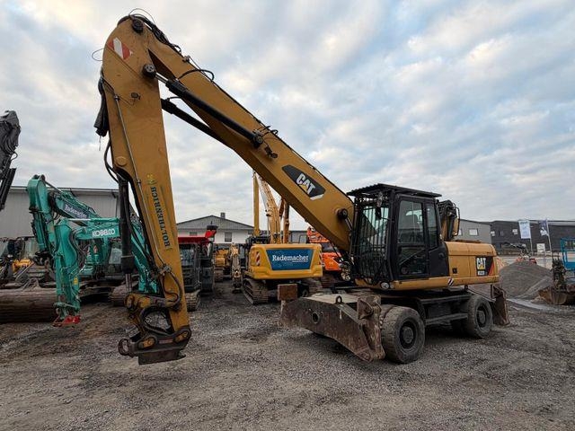 Pelle sur pneus Caterpillar M322D — occasion 2013, 10 050 h