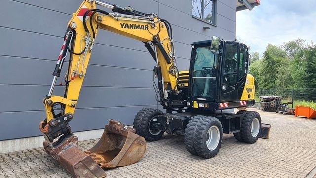 Pelle sur pneus Yanmar B95W - Powertilt HS08 - Zentralschmierung — occasion 2018, 2 864 h