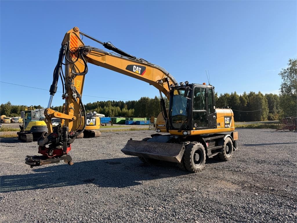 Pelle sur pneus Caterpillar M313D — occasion 2014, 8 011 h
