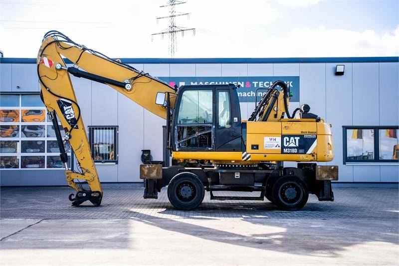 Pelle de manutention Caterpillar M318D MH — occasion 2014, 15 580 h