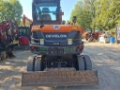 Pelle sur pneus Develon DX 57 W-7 — occasion 2024, 700 h