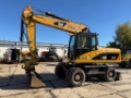 Pelle sur pneus Caterpillar M 318 D — occasion 2009, 13 199 h