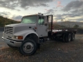 Camion plateau International 4900 — occasion 1999