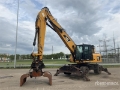 Caterpillar M318DMH Wheel Material Handler — occasion 2012, 22 187 h