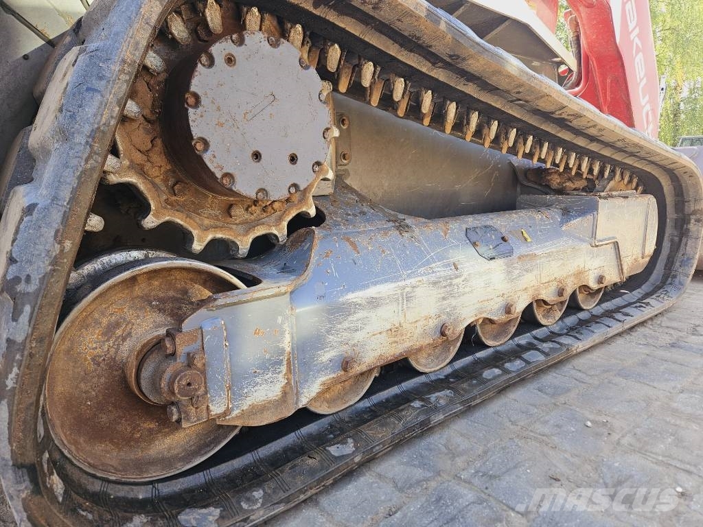 Takeuchi TL12 لوادر زحافة