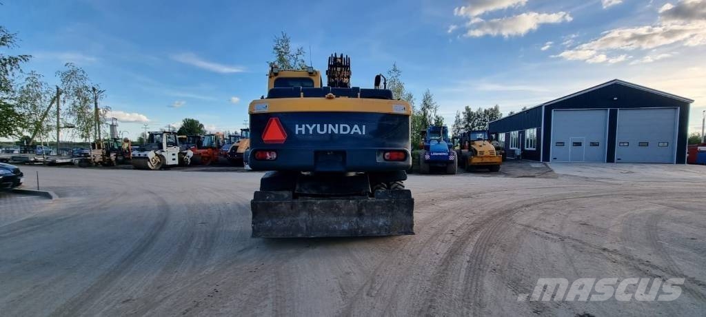 Hyundai Robex 140 W-9 حفارات بعجل