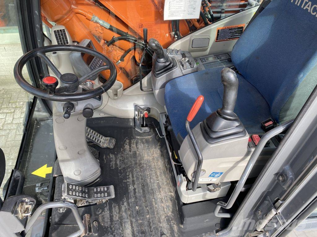 Hitachi ZX 140 W-3 حفارات بعجل