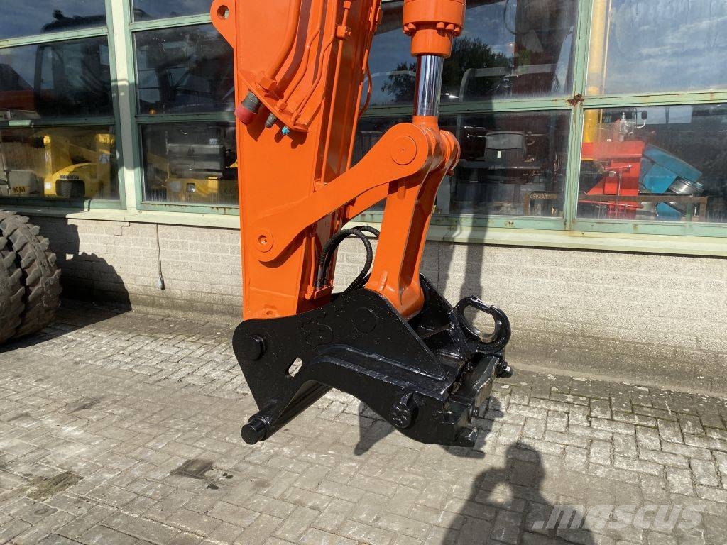 Hitachi ZX 140 W-3 حفارات بعجل