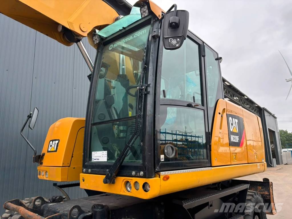 CAT M320F Pelle sur pneus