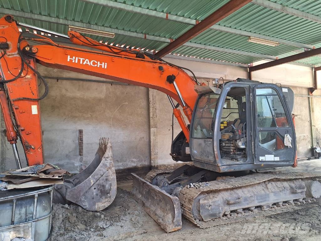 Hitachi ZX 135 US-3 حفارات زحافة