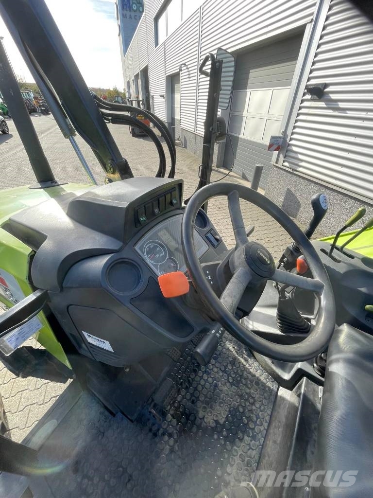 CLAAS Axos 340 tractor met Stoll voorlader Трактори