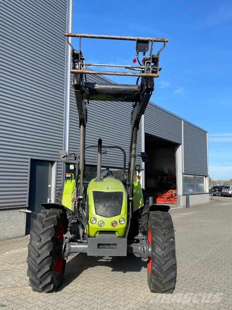 CLAAS Axos 340 tractor met Stoll voorlader Трактори