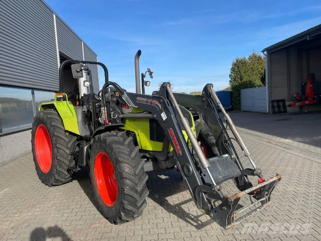 CLAAS Axos 340 tractor met Stoll voorlader Трактори