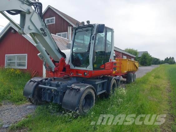 Takeuchi TB395W حفارات بعجل