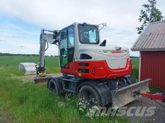 Takeuchi TB395W حفارات بعجل