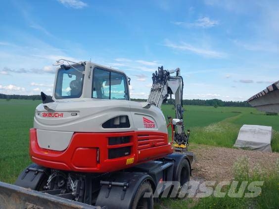 Takeuchi TB395W حفارات بعجل