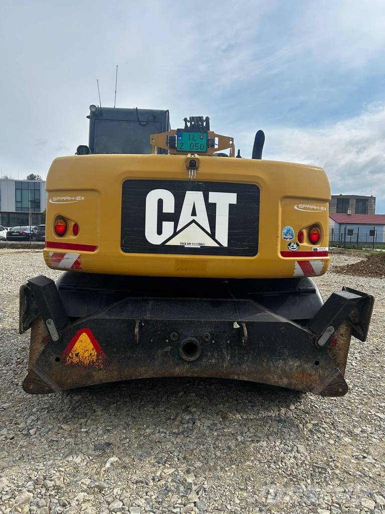 CAT 313 D Ekskavatori uz riteņiem