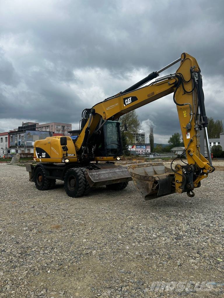 CAT 313 D Ekskavatori uz riteņiem