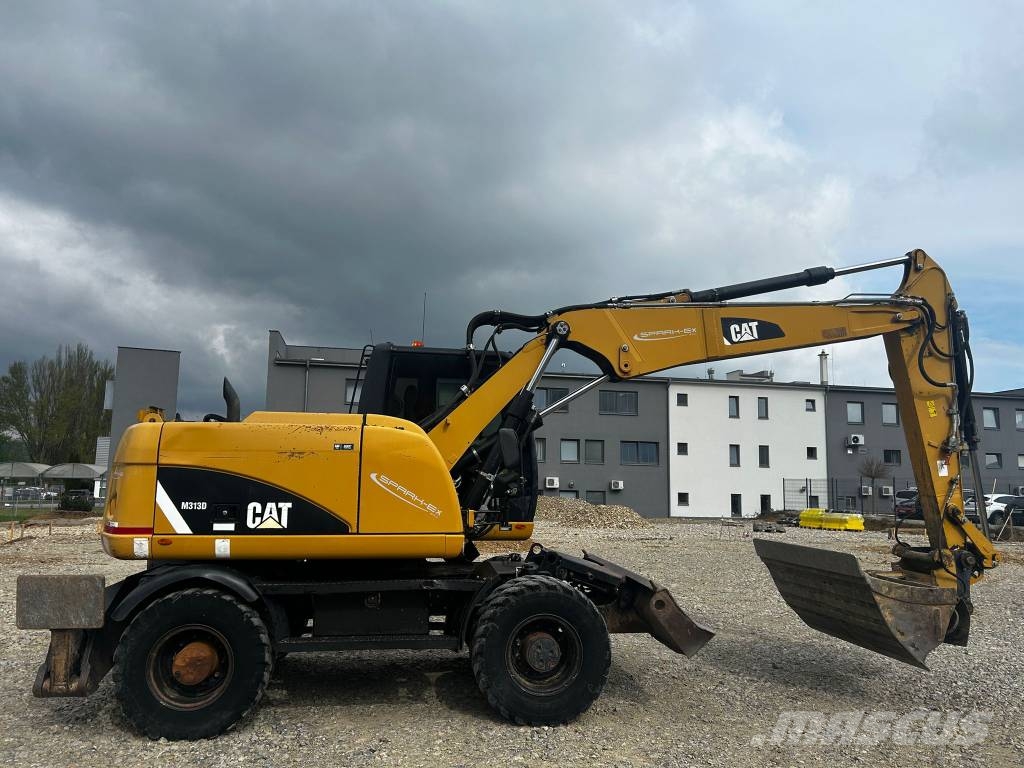 CAT 313 D Ekskavatori uz riteņiem