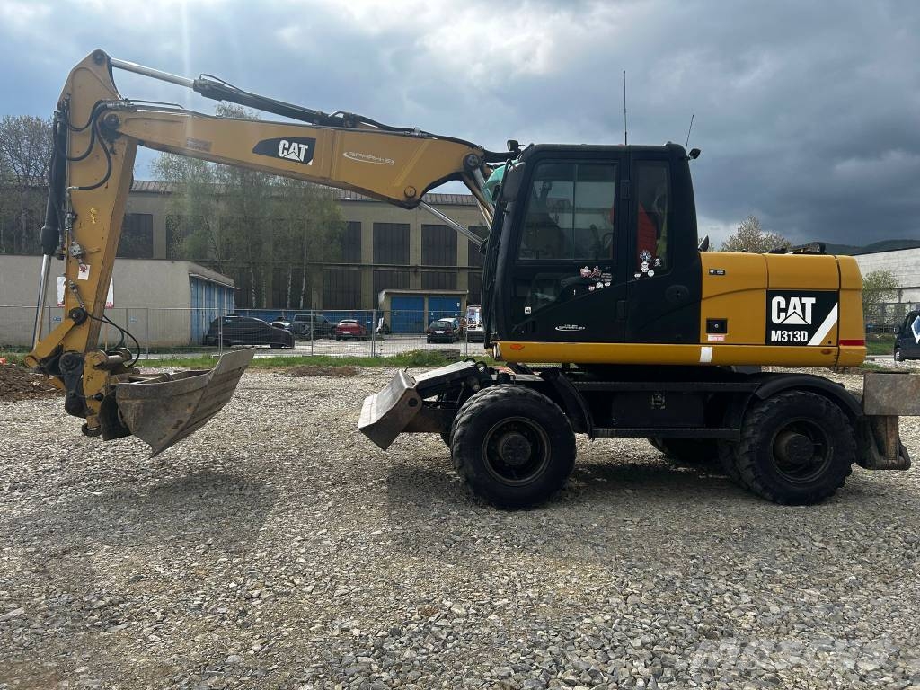 CAT 313 D Ekskavatori uz riteņiem