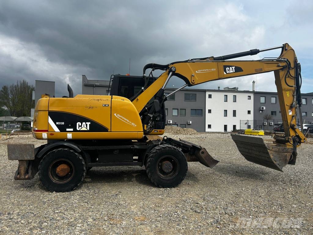 CAT 313 D Ekskavatori uz riteņiem