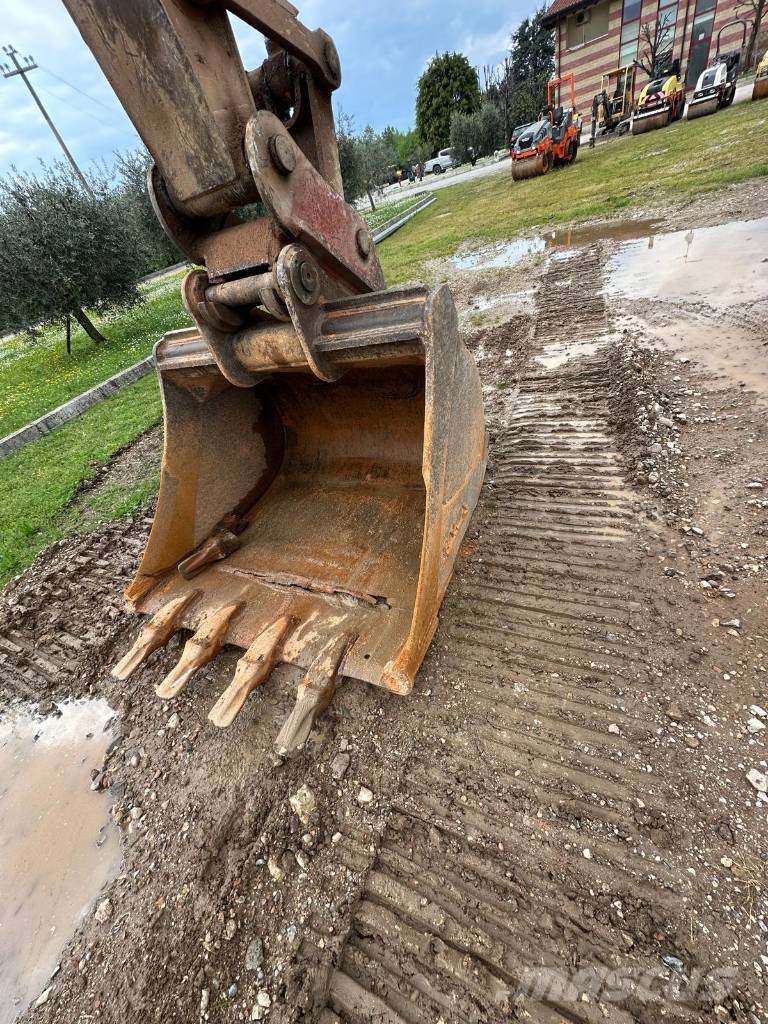 New Holland 305 Rupsgraafmachines