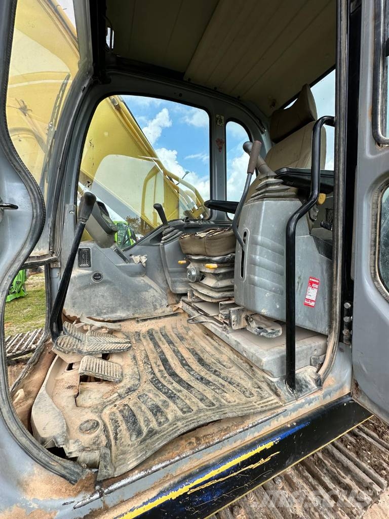 New Holland 305 Rupsgraafmachines