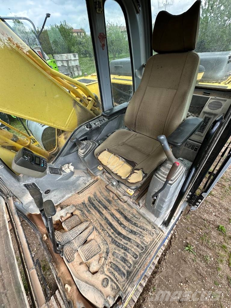 New Holland 305 Rupsgraafmachines