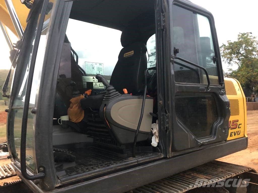 New Holland E 145 Bageri guseničari