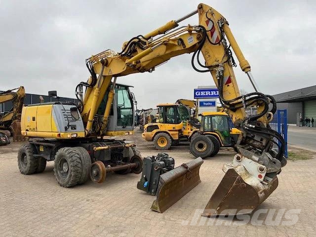 New Holland MH Plus 2wege Bagger Kiti kelių tiesimo įrengimai