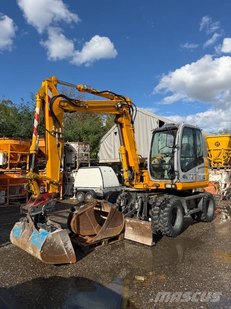 New Holland MH 2.6 حفارات بعجل