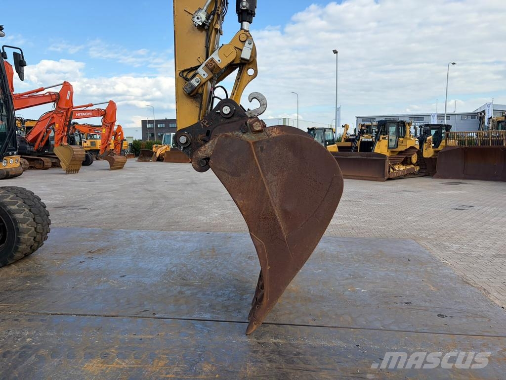 CAT M320F Pelle sur pneus