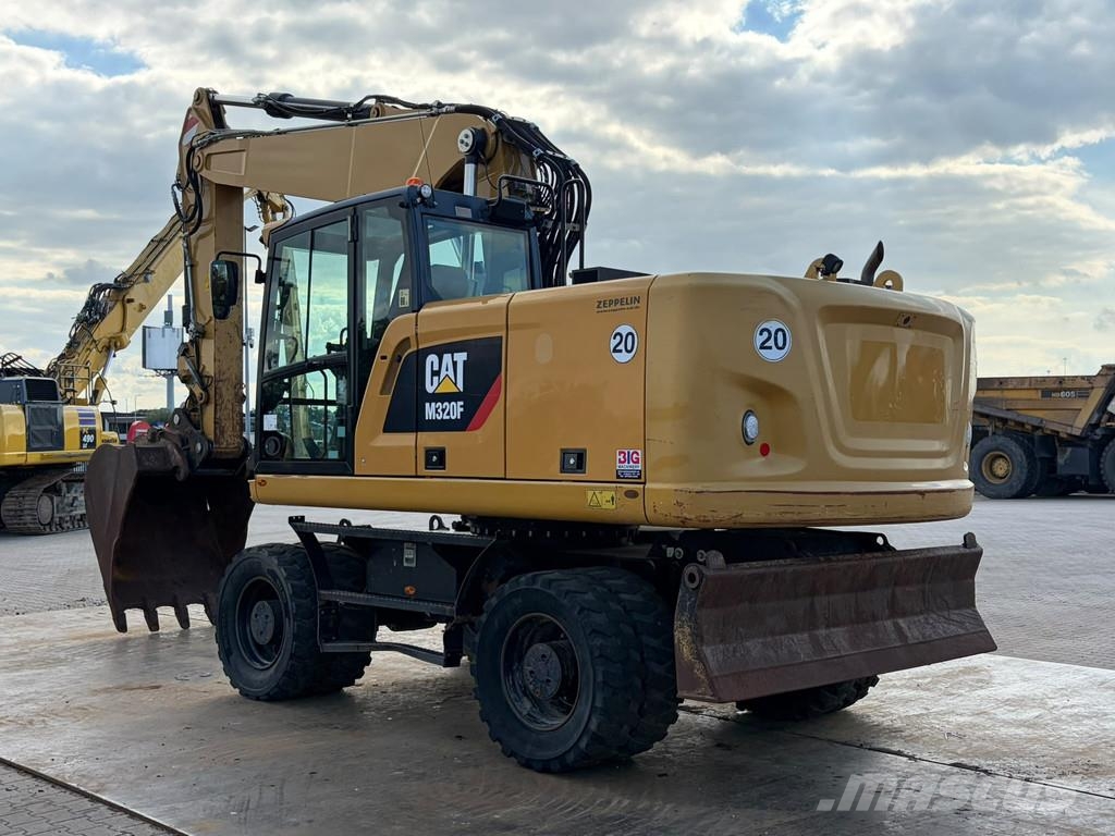 CAT M320F Pelle sur pneus