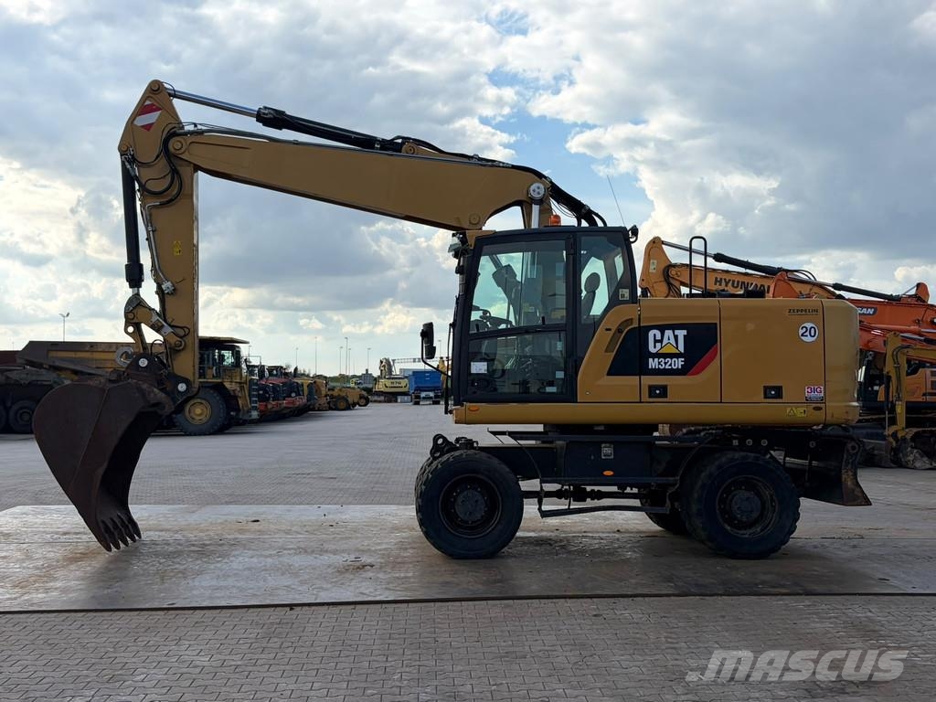 CAT M320F Pelle sur pneus