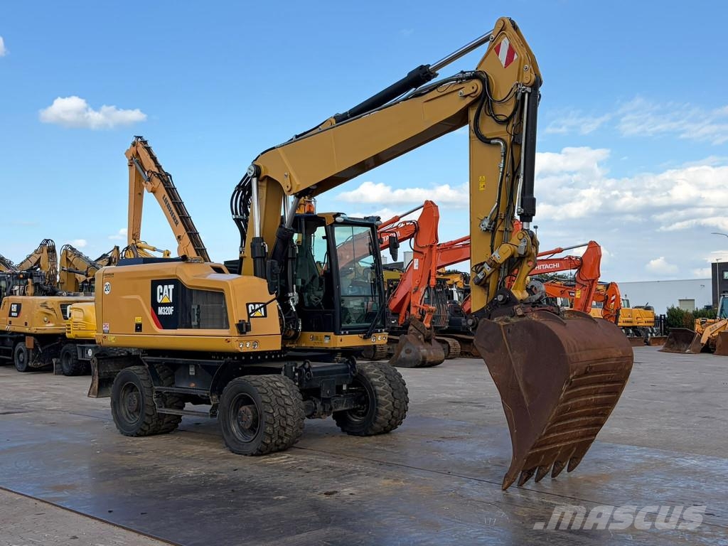 CAT M320F Pelle sur pneus