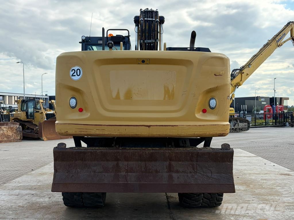 CAT M320F Pelle sur pneus