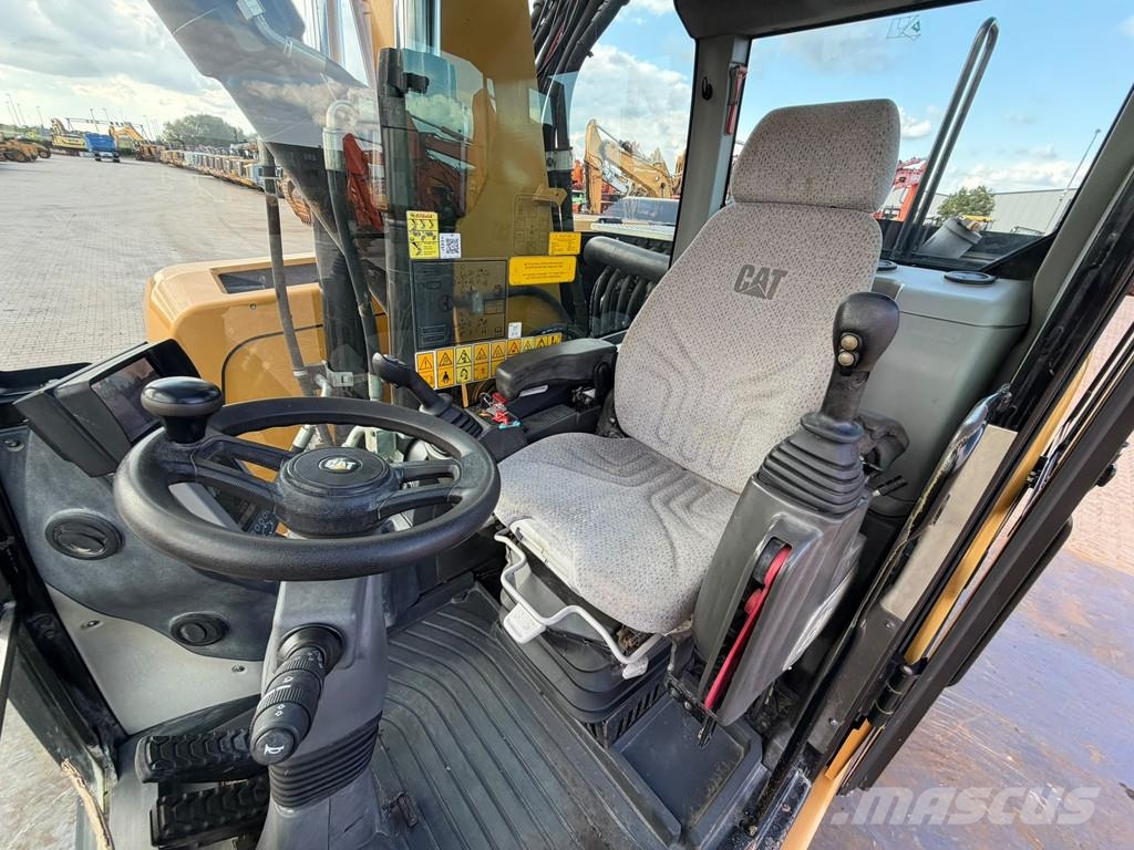 CAT M320F Pelle sur pneus