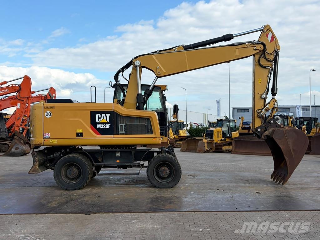 CAT M320F Pelle sur pneus