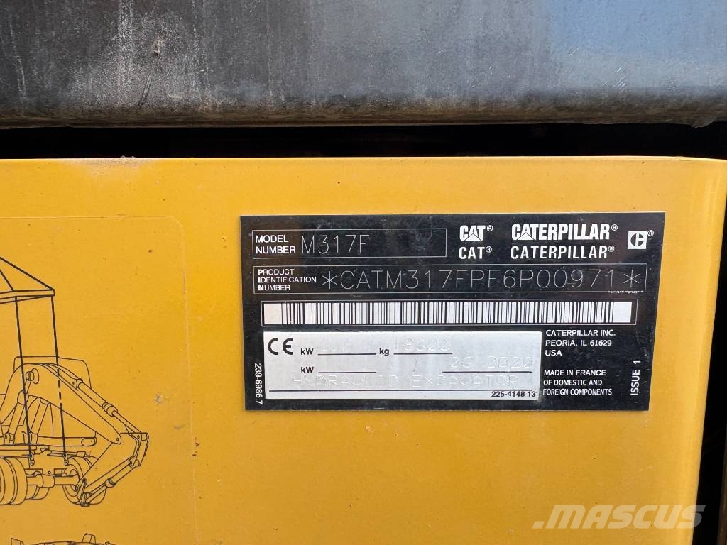 CAT M 317 حفارات بعجل